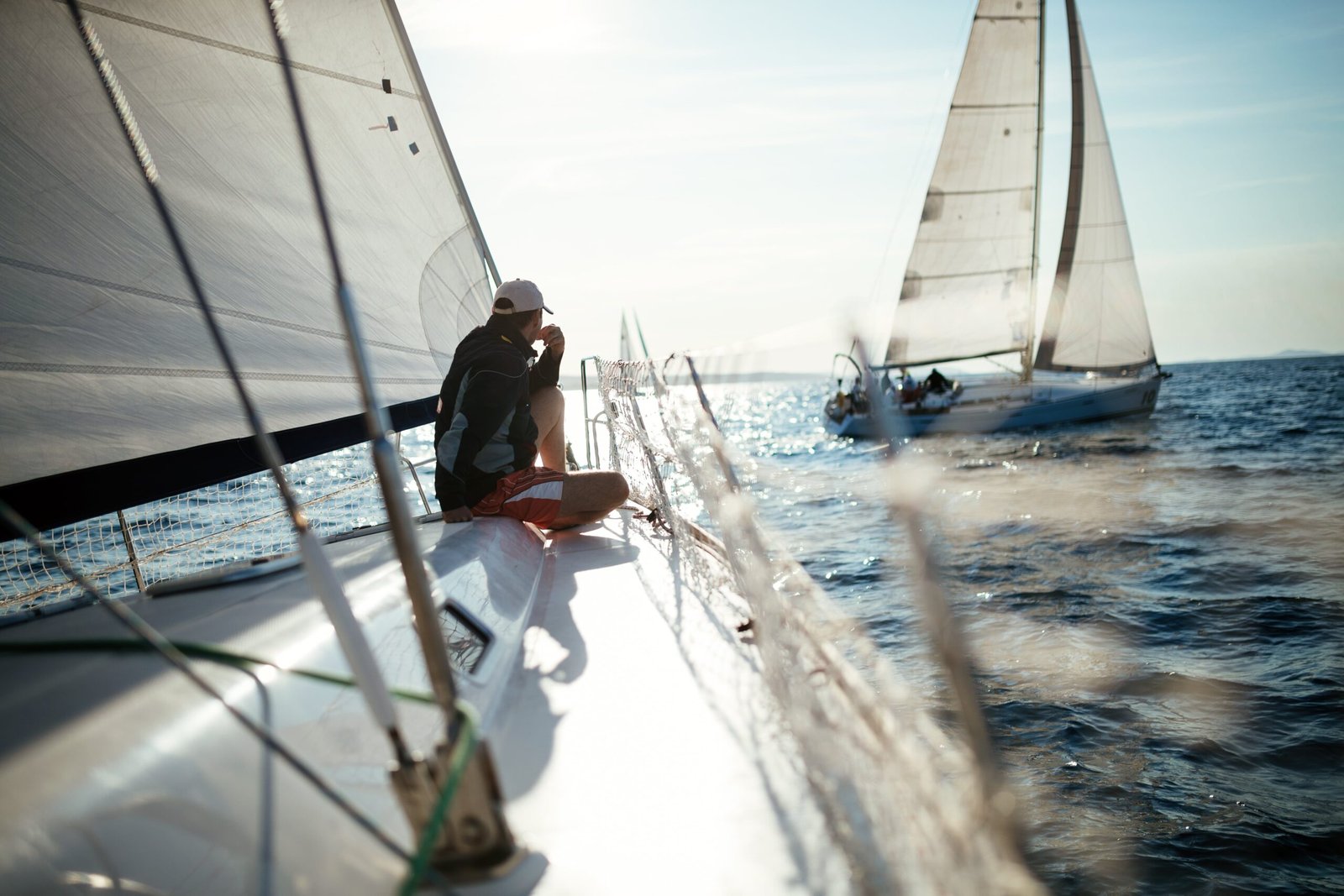 young-handsome-man-relaxing-on-his-sailboat-EA7SBYR-min